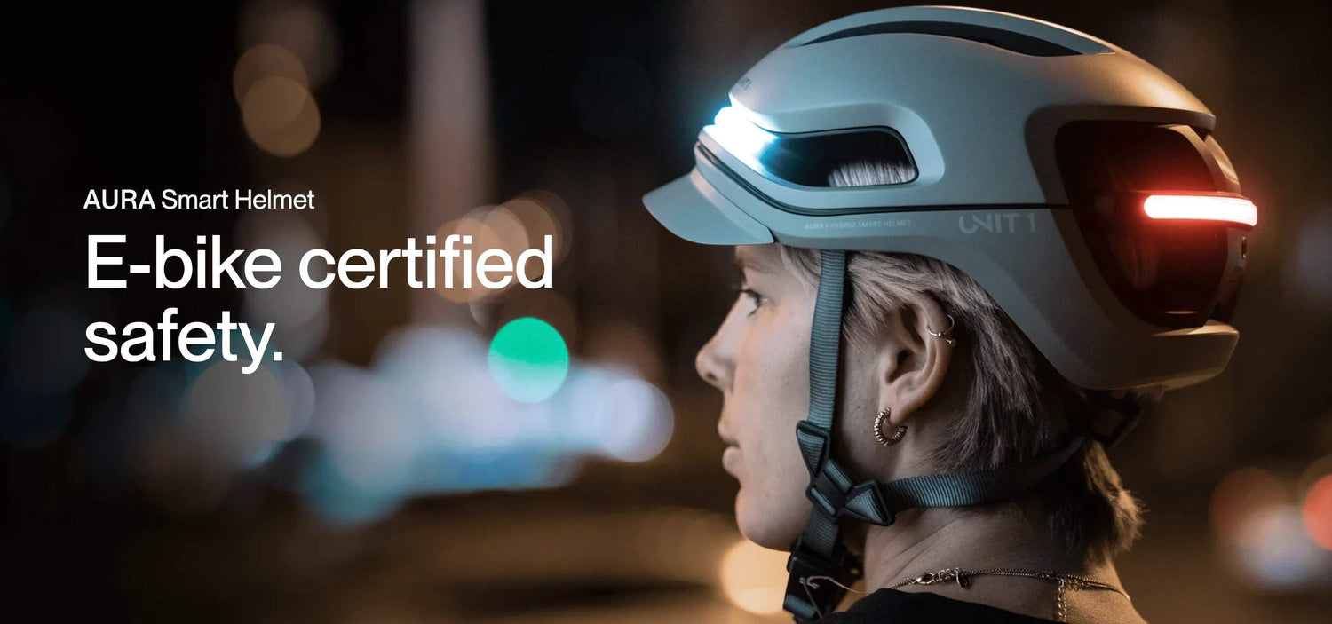 Person wearing UNIT 1 smart helmet with lights at night.