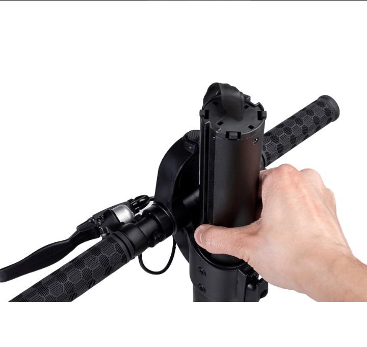 Hand removing battery from electric scooter handlebar compartment