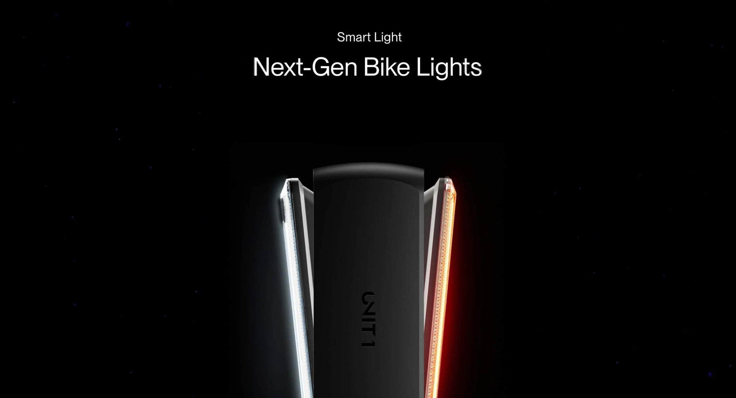 UNIT 1 next-gen smart bike light glowing red and white on black background