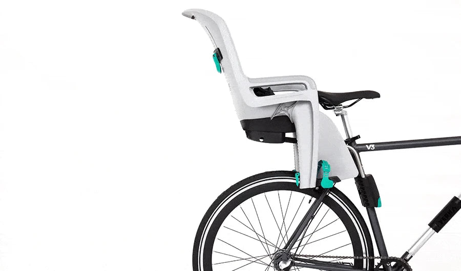 Rear-mounted child bike seat attached to adult bicycle frame